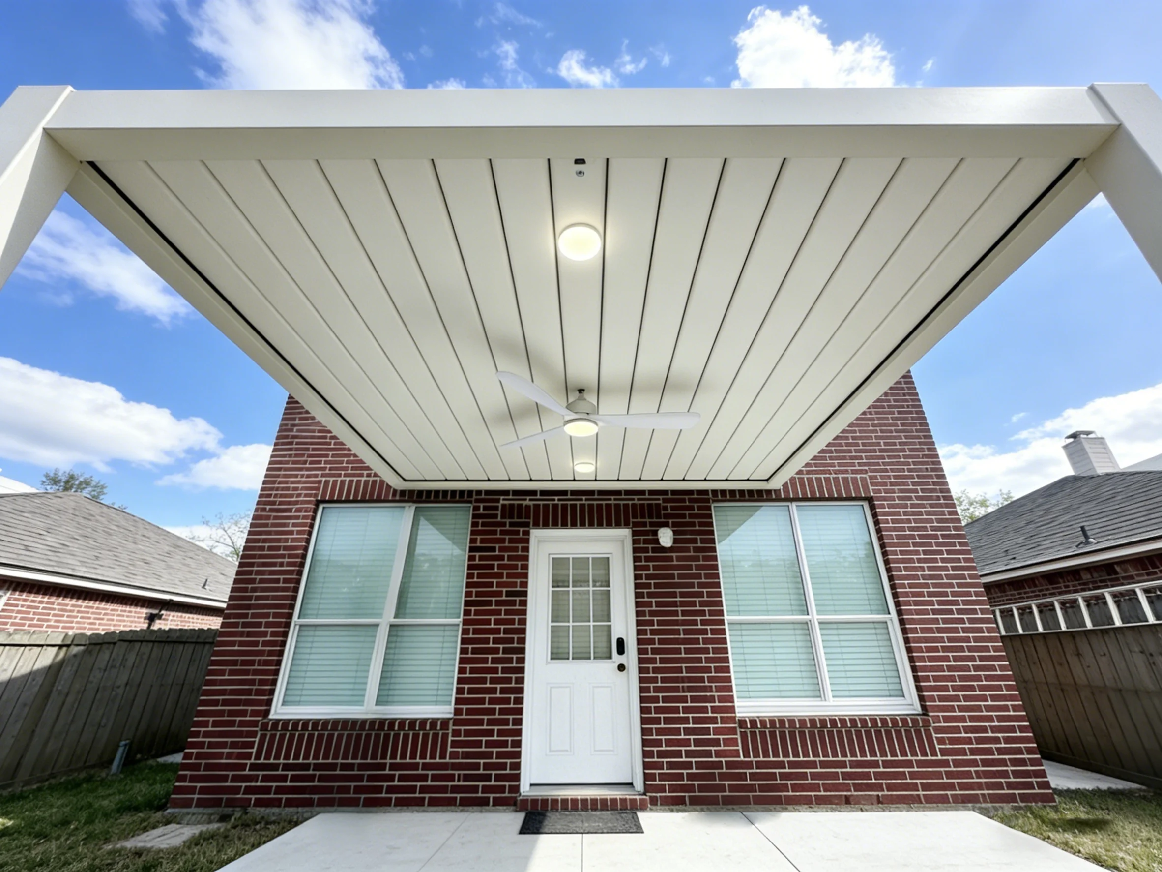 AT Louvre electric pergola with recessed LED lighting and ceiling fan
