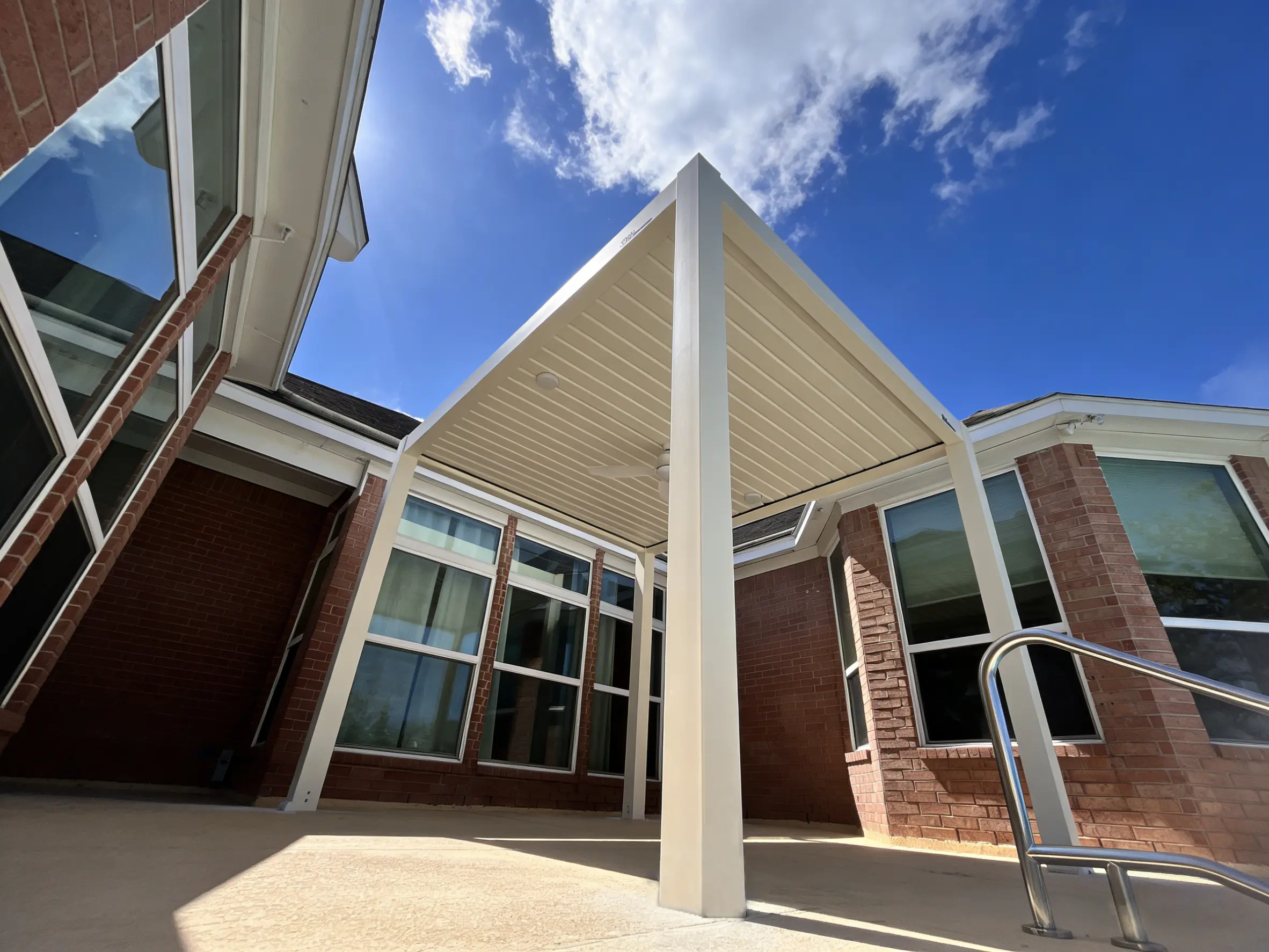 AT Louvre pergola interior with ceiling fan and LED lights