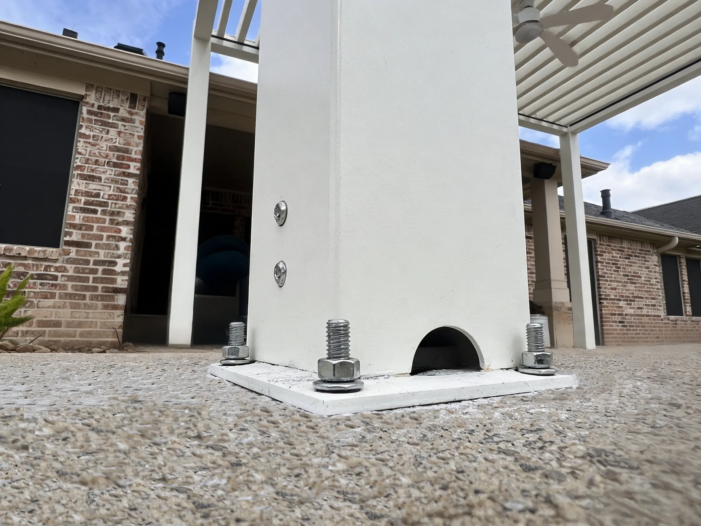 AT Louvre pergola post base with heavy-duty anchor bolts for secure concrete installation